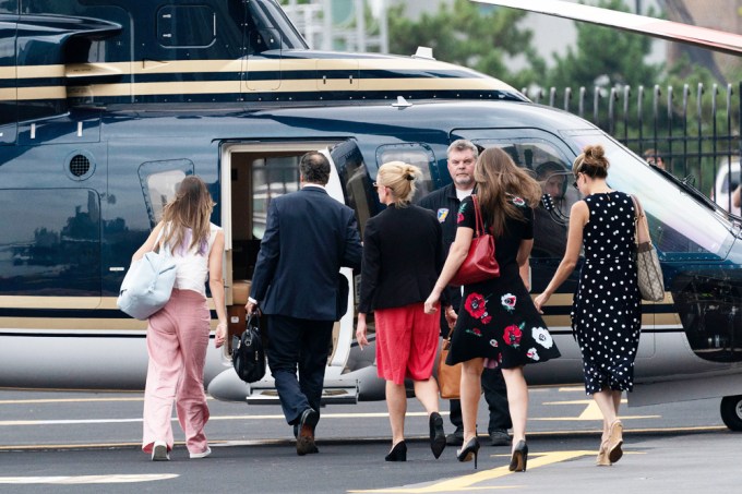 Andrew Cuomo & his crew get into a helicopter