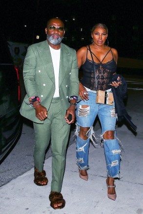 Miami, FL  - *EXCLUSIVE*  - NeNe Leakes and her boyfriend Nyonisela Sioh were seen arriving at Bar One restaurant for a dinner in Miami, Florida. NeNe looks casually chic in a lace body suit and baggy ripped jeans paired with heels.

Pictured: NeNe Leakes, Nyonisela Sioh

BACKGRID USA 9 MAY 2022 

USA: +1 310 798 9111 / usasales@backgrid.com

UK: +44 208 344 2007 / uksales@backgrid.com

*UK Clients - Pictures Containing Children
Please Pixelate Face Prior To Publication*