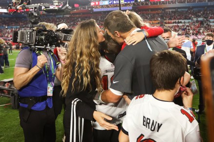 Tampa Bay Buccaneers quarterback Tom Brady (12) celebrates with his family following the NFL Super Bowl 55 football game against the Kansas City Chiefs, Sunday, Feb. 7, 2021 in Tampa, Fla. Tampa Bay won 31-9 to win Super Bowl LV. (Ben Liebenberg via AP)