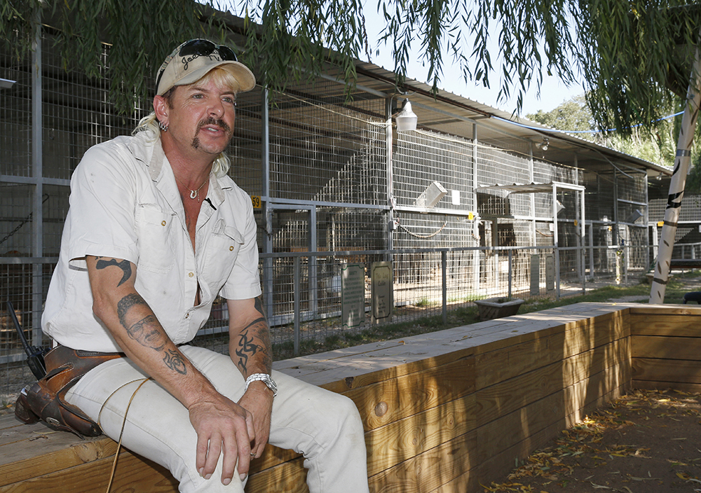 FILE - In this Aug. 28, 2013, file photo, Joseph Maldonado answers a question during an interview at the zoo he runs in Wynnewood, Okla. Authorities continue to investigate the shooting death of Maldonado's husband. Maldonado said his husband accidentally shot himself Friday, Oct. 6, 2017, at The Greater Wynnewood Exotic Animal Park. (AP Photo/Sue Ogrocki, File)