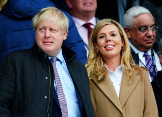Editorial Use OnlyMandatory Credit: Photo by Javier Garcia/BPI/Shutterstock (10574700ha)Prime Minister Boris Johnson alongside Carrie SymondsEngland v Wales, Guinness Six Nations, Rugby Union, Twickenham Stadium, London, UK - 07 Mar 2020