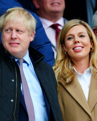 Editorial Use OnlyMandatory Credit: Photo by Javier Garcia/BPI/Shutterstock (10574700ha)Prime Minister Boris Johnson alongside Carrie SymondsEngland v Wales, Guinness Six Nations, Rugby Union, Twickenham Stadium, London, UK - 07 Mar 2020