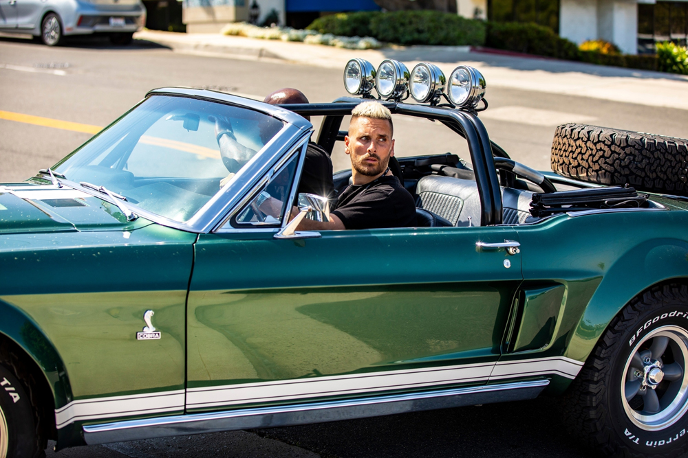 Calabasas, CA  - *EXCLUSIVE*  - Scott Disick appears to have purchased a Mustang from Richard Rawlins of Gas Monkey Garage. Scott drove the mustang to Mullholland Harley Davidson where he was seen vaping and looking to purchase a motorcycle. Scott was also sporting a mohawk/mullet hairdoo and appears to be trying his best to rock out his image to keep up with Travis Barker and win back Kourtney Kardashian's attention. Scott was also seen wearing a vape around his neck and hitting it while he was talking to the manager of the shop. Scott has completely dumped his preppy boy image and is now going hard core towards MGK and Travis Barker's rocker image.

Pictured: Scott Disick

BACKGRID USA 17 MAY 2021 

BYLINE MUST READ: IXOLA / BACKGRID

USA: +1 310 798 9111 / usasales@backgrid.com

UK: +44 208 344 2007 / uksales@backgrid.com

*UK Clients - Pictures Containing Children
Please Pixelate Face Prior To Publication*