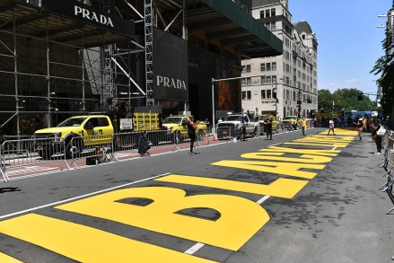 People pose with a new Black Lives Matter mural outside of Trump Tower on Fifth Avenue in New York.
Black Lives Matter mural, New York, USA - 09 Jul 2020