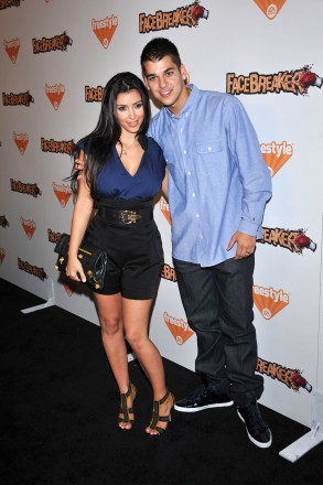 Kim Kardashian West and brother Rob
EA Sports Freestyle presents 'Facebreaker' Launch Party, Los Angeles, America - 03 Sep 2008
FaceBreaker is a boxing video game created by Fight Night developers, EA Canada. With a "cartoony" artistic style the game allows players to 'break' their opponents’ faces as it features 'real-time facial deformation'. The game also uses face-capture technology to allow players to capture and use their own image. As well as a host of normal characters there are several celebrity 'guest' characters, including Heidi Montag, Spencer Pratt and Kim Kardashian.