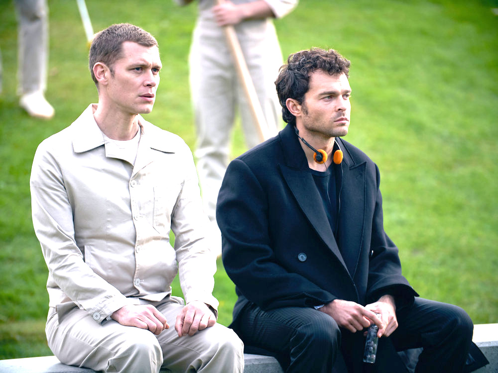 BRAVE NEW WORLD -- Episode 108 -- Pictured: (l-r) Joseph Morgan as Cjack 60/57, Alden Ehrenreich as John the Savage -- (Photo by: Steve Schofield/Peacock)