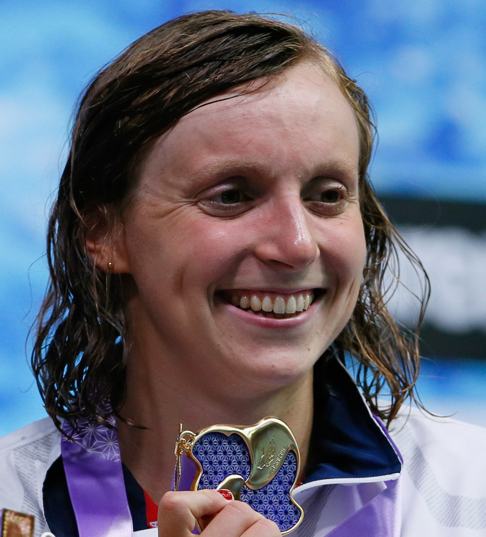 Katie Ledecky of the U.S., poses with her medal on the podium after winning the women's 1500m freestyle timed final during the Pan Pacific swimming championships in Tokyo, Sunday, Aug.12, 2018.(AP Photo/Koji Sasahara)