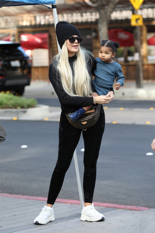 Khloe Kardashian holding True Thompson 