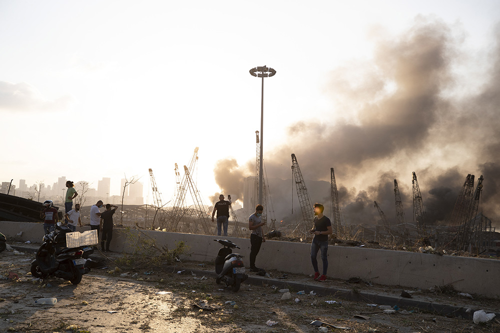 Aftermath of a massive explosion is seen in in Beirut, Lebanon, Tuesday, Aug. 4, 2020. Massive explosions rocked downtown Beirut on Tuesday, flattening much of the port, damaging buildings and blowing out windows and doors as a giant mushroom cloud rose above the capital. Witnesses saw many people injured by flying glass and debris. (AP Photo/Hassan Ammar)