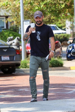 EXCLUSIVE: Brian Austin Green is in a cheery mood grabbing his morning coffee from Starbucks in Malibu. 15 Jul 2020 Pictured: Brian Austin Green is in a cheery mood grabbing his caffeine fix. Photo credit: Rachpoot/MEGA TheMegaAgency.com +1 888 505 6342 (Mega Agency TagID: MEGA688763_002.jpg) [Photo via Mega Agency]