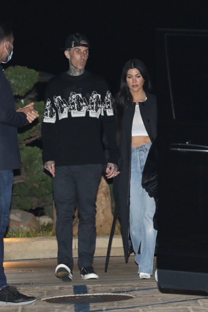 Kourtney Kardashian wears baggy jeans for date night.