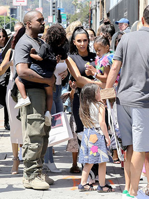Kim Kardashian & Kanye West with their kids