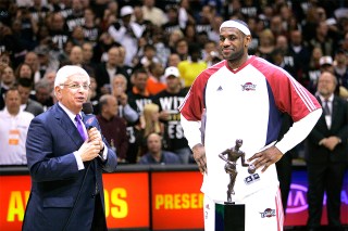 NBA Commissioner David Stern, left, presents Cleveland Cavaliers' LeBron James with the 2008-2009 MVP trophy before an Eastern Conference semifinal basketball game against the Atlanta Hawks Tuesday, May 5, 2009, in Cleveland. (AP Photo/Mark Duncan)