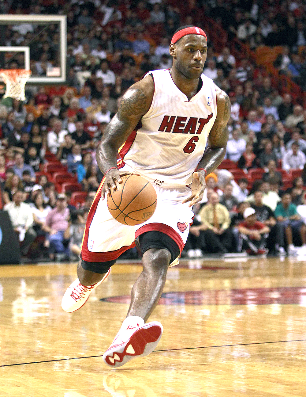 Miami Heat's LeBron James drives against the Detroit Pistons an NBA basketball game in Miami, Wednesday, Dec. 1, 2010. (AP Photo/Alan Diaz)