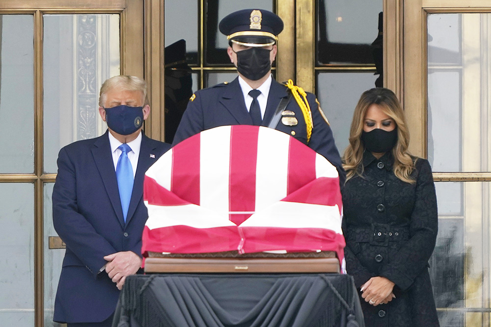 President Donald Trump and first lady Melania Trump pay respects as Justice Ruth Bader Ginsburg lies in repose at the Supreme Court building on Thursday, Sept. 24, 2020, in Washington. Ginsburg, 87, died of cancer on Sept. 18. (AP Photo/J. Scott Applewhite)