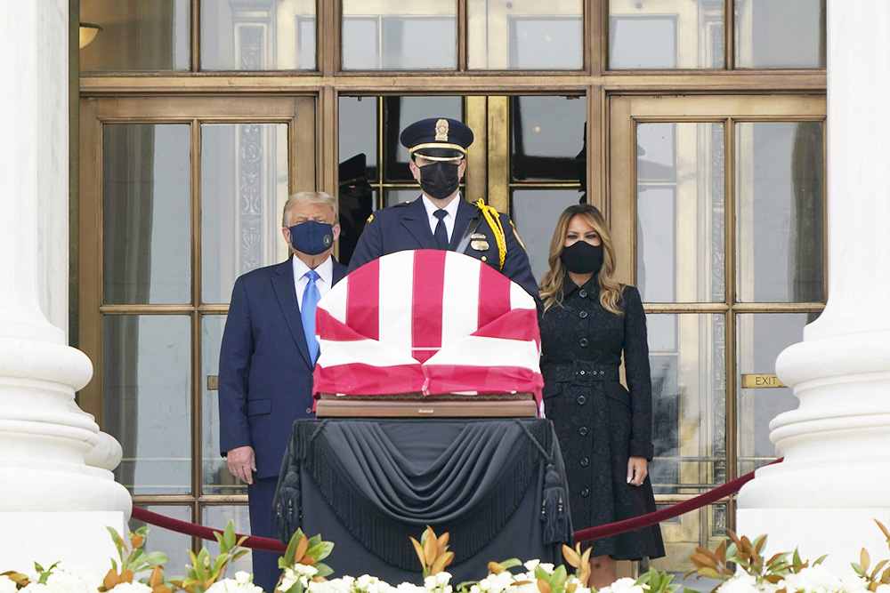 President Donald Trump and first lady Melania Trump pay respects as Justice Ruth Bader Ginsburg lies in repose at the Supreme Court building on Thursday, Sept. 24, 2020, in Washington. Ginsburg, 87, died of cancer on Sept. 18. (AP Photo/J. Scott Applewhite)