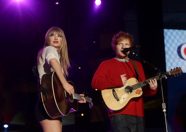 Taylor Swift and Ed Sheeran. File photo dated 09/06/13 of Taylor Swift and Ed Sheeran, as Ed Sheeran has said he will "always stick up" for his good friend and fellow singer Taylor Swift. Issue date: Sunday June 25, 2017. Sheeran, 26, and Swift, 27, have been firm friends since he toured with her in 2013.Chart-topping singer-songwriter Sheeran also revealed he "hooked up" with some of her famous friends in the early days of their friendship.See PA story SHOWBIZ Sheeran. Photo credit should read: Yui Mok/PA Wire URN:31820910