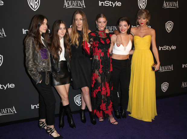 From left, Danielle Haim, Alana Haim and Este Haim of Haim with Jaime King, Lorde and Taylor Swift arrive at the 16th annual InStyle and Warner Bros. Golden Globes afterparty at the Beverly Hilton Hotel on Sunday, Jan. 11, 2015, in Beverly Hills, Calif. (Photo by Matt Sayles/Invision/AP)