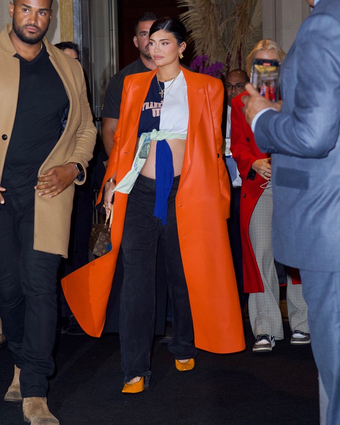 Kylie Jenner in a Crop Top and Orange Coat