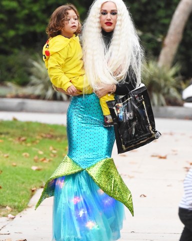 Los Angeles, CA  - *EXCLUSIVE*  - Singer and TV host Gwen Stefani dressed as a mermaid for Halloween and revealed a distinct stomach bump in her tight outfit. Her father also joined her to help her with her children. Apollo was dressed as Pikachu and Zuma was dressed as an even larger, inflatable Pikachu while Kingston sported a more classic Halloween look. Shot on 11/01/17Pictured: Gwen Stefani, Apollo RossdaleBACKGRID USA 1 NOVEMBER 2017 USA: +1 310 798 9111 / usasales@backgrid.comUK: +44 208 344 2007 / uksales@backgrid.com*UK Clients - Pictures Containing ChildrenPlease Pixelate Face Prior To Publication*
