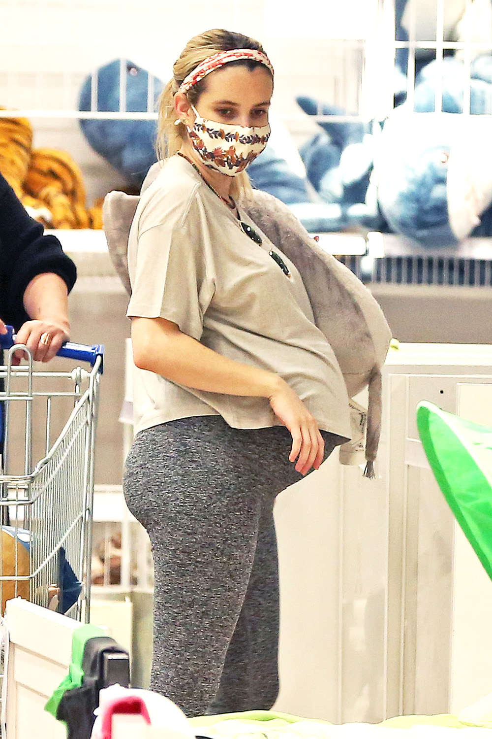 EXCLUSIVE: Emma Roberts puts her growing baby bump on display as she does some shopping at Ikea