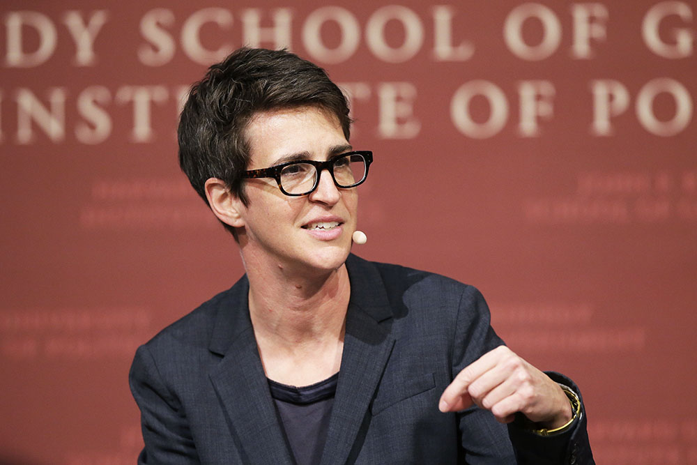 FILE - In this Oct. 16, 2017 file photo, MSNBC television anchor Rachel Maddow, host of "The Rachel Maddow Show," moderates a panel at a forum called "Perspectives on National Security," at the John F. Kennedy School of Government, at Harvard University, in Cambridge, Mass. MSNBC's Rachel Maddow said Friday, Nov. 6, 2020 she is quarantining after being in contact with someone who tested positive for the coronavirus. Maddow said on social media that she tested negative so far for COVID-19 but plans to remain at home until it's “safe for me to be back at work without putting anyone at risk.” (AP Photo/Steven Senne, File)