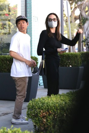 West Hollywood, CA  - *EXCLUSIVE*  - Angelina Jolie keeps her classy look wearing all black carrying a black leather designer tote while furniture shopping at high-end Knoll Home Design Shop with her 17-year-old son Pax.

Pictured: Angelina Jolie, Pax Thien Jolie-Pitt

BACKGRID USA 3 JULY 2021 

USA: +1 310 798 9111 / usasales@backgrid.com

UK: +44 208 344 2007 / uksales@backgrid.com

*UK Clients - Pictures Containing Children
Please Pixelate Face Prior To Publication*