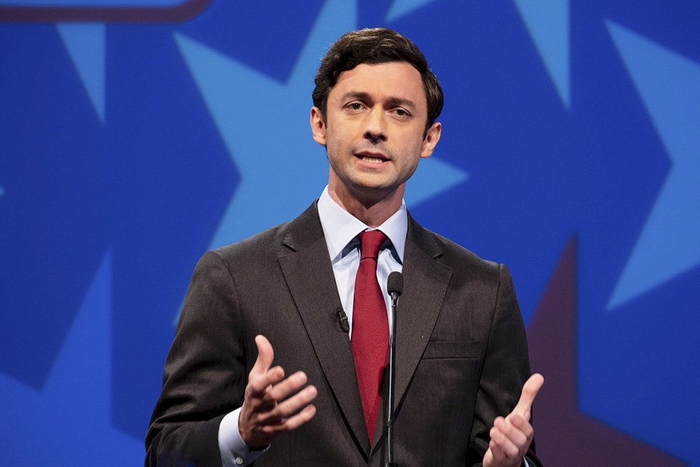 Democratic challenger Jon Ossoff speaks during a debate for U.S. Senate on Sunday, Dec. 6, 2020, in Atlanta. Sen. David Perdue declined to attend the debate. (AP Photo/Ben Gray, Pool)