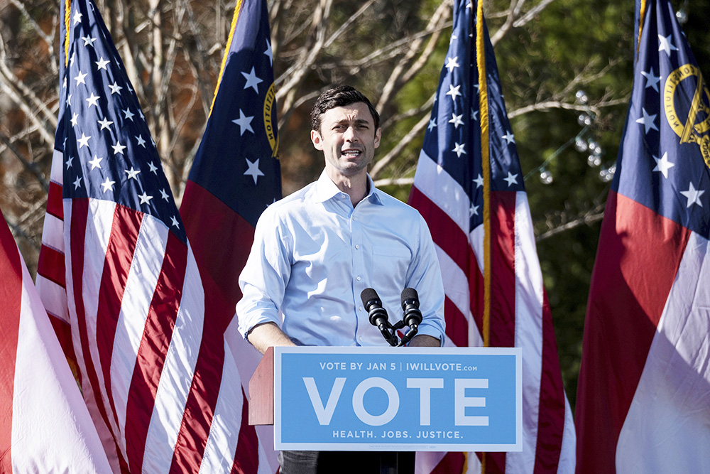 Democratic U.S. Senate challenger Jon Ossoff speaks during a rally, Monday, Dec. 21, 2020 in Columbus, Ga. with Vice President-Elect Kamala Harris and fellow Democratic U.S. Senate challenger the Rev. Raphael Warnock. (AP Photo/Ben Gray)