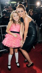 Miley Cyrus, right, star of "The Last Song," poses with her sister Noah Cyrus on the red carpet at the premiere of the film in Los Angeles, Thursday, March 25, 2010. (AP Photo/Chris Pizzello)