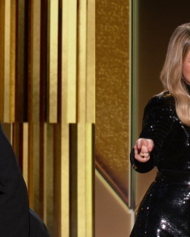 78th ANNUAL GOLDEN GLOBE AWARDS -- Pictured in this screen grab: (l-r) Hosts, Tina Fey and Amy Poehler at the 78th Annual Golden Globe Awards on February 28, 2021. -- (Photo by: NBC)