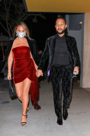 Grammy Winner John Legend and wife Chrissy Teigen stun as they celebrate his Grammy win. 14 Mar 2021 Pictured: Grammy Winner John Legend and wife Chrissy Teigen stun as they celebrate his win. Photo credit: Rachpoot/MEGA TheMegaAgency.com +1 888 505 6342 (Mega Agency TagID: MEGA739599_001.jpg) [Photo via Mega Agency]