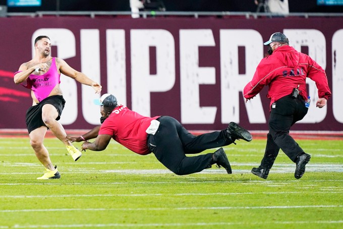 A Fan Runs On To The Field During The Super Bowl