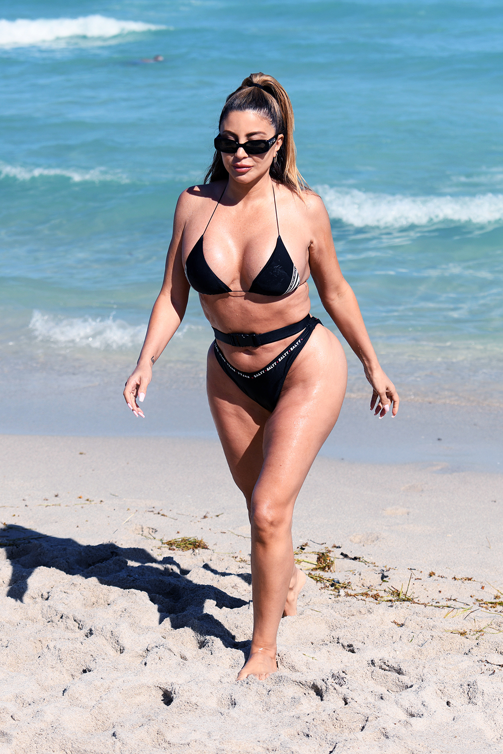 EXCLUSIVE: Larsa Pippen shows off her famous curves in a unique belted bikini that says "salty" as she hits the beach in Miami