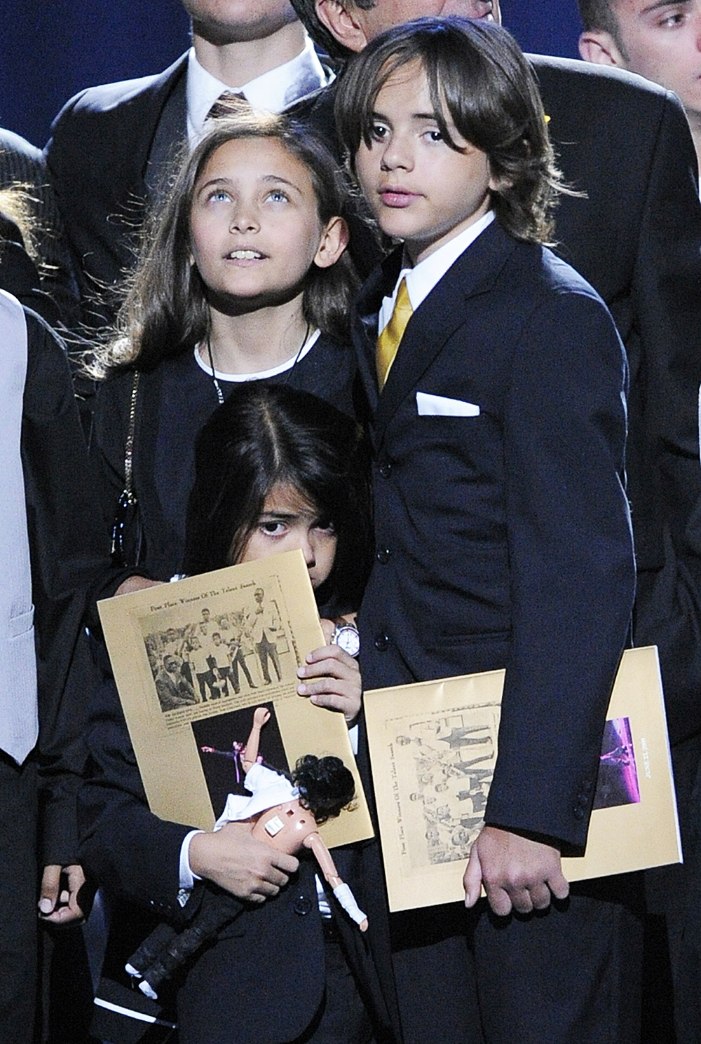 Paris Jackson, left, Prince Michael Jackson I and Prince Michael Jackson II on stage during the memorial service for Michael Jackson at the Staples Center in Los Angeles, Tuesday, July 7, 2009. (AP Photo/Mark J. Terrill, Pool)