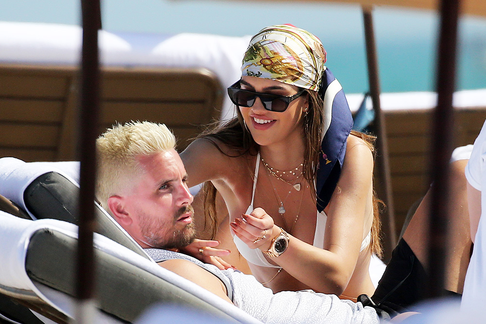 Bikini clad Amelia Hamlin happily applies sunscreen to boyfriend Scott Disick as they relax on the beach on Valentine's Day in Miami. 14 Feb 2021 Pictured: Scott Disick; Amelia Hamlin. Photo credit: MEGA TheMegaAgency.com +1 888 505 6342 (Mega Agency TagID: MEGA733444_007.jpg) [Photo via Mega Agency]