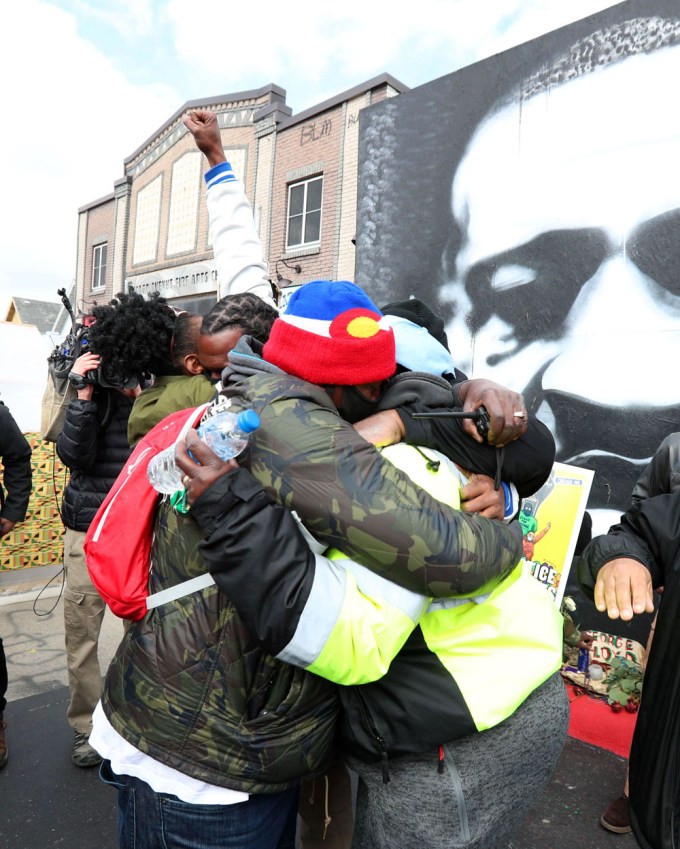 People hug at George Floyd Square