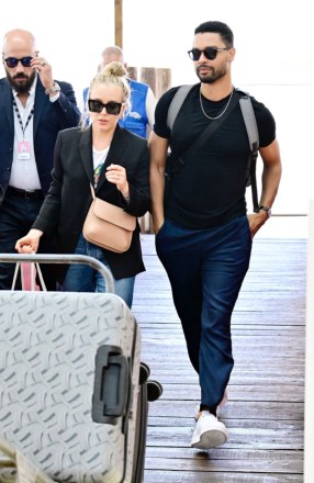 Venice, ITALY  - *EXCLUSIVE*  - 'Bridgerton' actor Rege-Jean Page is pictured looking suave while seen with his girlfriend Emily Brown seen leaving Venice Airport after attending the 2022 international Venice film festival.

Pictured: Regé-Jean Page, Emily Brown

BACKGRID USA 6 SEPTEMBER 2022 

BYLINE MUST READ: Cobra Team / BACKGRID

USA: +1 310 798 9111 / usasales@backgrid.com

UK: +44 208 344 2007 / uksales@backgrid.com

*UK Clients - Pictures Containing Children
Please Pixelate Face Prior To Publication*