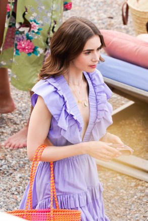 Saint-Jean-Cap-Ferrat, FRANCE  - British-American actress Lily Collins pictured in character while on set filming scenes for season 2 of Netflix series 'Emily In Paris' in Saint-Jean-Cap-Ferrat, France.

Pictured: Lily Collins

BACKGRID USA 4 MAY 2021 

USA: +1 310 798 9111 / usasales@backgrid.com

UK: +44 208 344 2007 / uksales@backgrid.com

*UK Clients - Pictures Containing Children
Please Pixelate Face Prior To Publication*