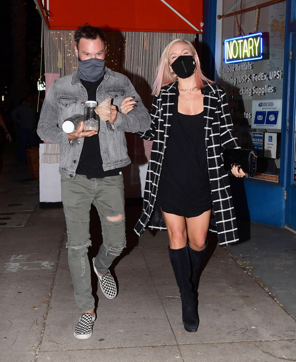 Los Angeles, CA  - *EXCLUSIVE*  - Brian Austin Green and Sharna Burgess were spotted out on a date night Tuesday, but it wasn't at the most likely location. The pair were seen arriving at the Grand Opening of "Sugar Taco" in Sherman Oaks, which is co-owned by his ex, Australian Model, Tina Louise. The amicable exes were seen greeting each other , outside, before Tina gave both of them a tour of the colorful Vegan Mexican restaurant. Brian and Sharna dined together for 30 minutes, grabbing drinks and vegan tacos while chatting happily with friends. As they left, they both stopped to give Tina a big hug. Everyone seemed in great spirits throughout the evening, including Brian who has still been dealing with his ongoing divorce with Megan Fox. She is said to be hoping to move on quickly from the past, but rumors are that Brian has been making the process more difficult than it needs to be, delaying her from moving forward with her steamy new relationship with Machine Gun Kelly

Pictured: Brian Austin Green and Sharna Burgess

BACKGRID USA 3 FEBRUARY 2021 

USA: +1 310 798 9111 / usasales@backgrid.com

UK: +44 208 344 2007 / uksales@backgrid.com

*UK Clients - Pictures Containing Children
Please Pixelate Face Prior To Publication*