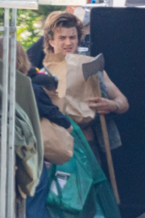 Atlanta, GA  - *EXCLUSIVE*  - The Cast of 'Stranger Things' prepares for War as the main cast plus 3 new members get into character to film the next season while on location, in Atlanta and from the look of it, things are about to get real! A shirtless Joe Kerry was seen bruised as they prepared to film a battle scene with Natalia Dyer holding a shotgun. Sadie Sink, Maya Hawk and new cast members are scene in these new images! *Shot on June 14, 2021*

Pictured: Joe Keery

BACKGRID USA 15 JUNE 2021 

USA: +1 310 798 9111 / usasales@backgrid.com

UK: +44 208 344 2007 / uksales@backgrid.com

*UK Clients - Pictures Containing Children
Please Pixelate Face Prior To Publication*