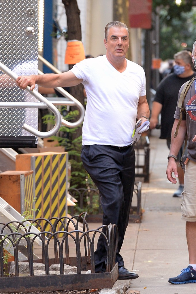 Chris Noth standing on set