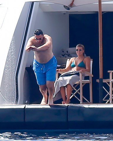 EXCLUSIVE: Sofia Richie in a green bikini and her fiance Elliot Grainge enjoy a swim in the sea aboard a yacht in Ibiza on July 25, 2022 in Ibiza, Spain. 25 Jul 2022 Pictured: Sofia Richie and Elliot Grainge. Photo credit: Elkin Cabarcas / MEGA TheMegaAgency.com +1 888 505 6342 (Mega Agency TagID: MEGA881216_032.jpg) [Photo via Mega Agency]