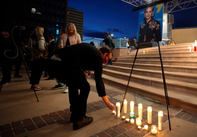 A man lights a candle