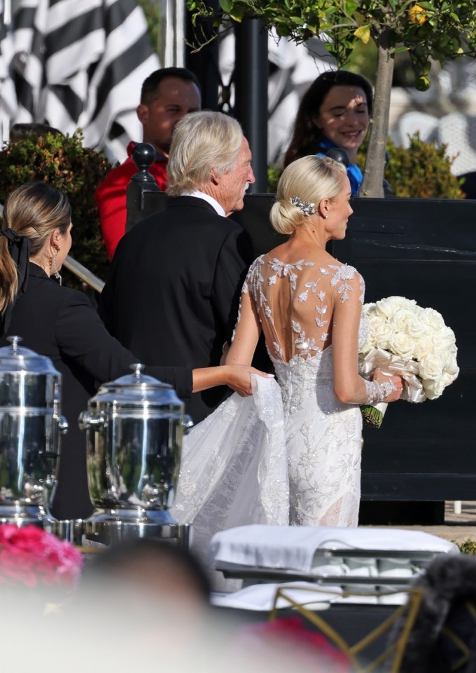 Heather Rae Young walks down the aisle