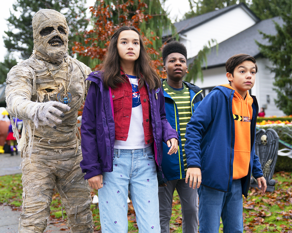 UNDER WRAPS - Disney's "Under Wraps" follows three 12-year-old friends, Gilbert, Marshall and Amy, as they accidentally revive a mummy they discover in a neighbor's basement.  They affectionately name the mummy Harold and must rush to return him to his resting place before midnight on Halloween. Along the way, the team narrowly escapes a nefarious group of criminals intent on selling the mummy to the highest bidder. When Harold is inevitably captured, Marshall, Gilbert and Amy must band together to stand up to the criminals, face their fears and rescue their new - but rather "ancient"- friend.(Disney/David Bukach)PHIL WRIGHT, SOPHIA HAMMONS, CHRISTIAN J. SIMON, MALACHI BARTON