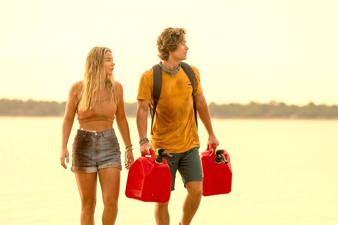 Chase Stokes & Madelyn Cline Carry Gas Cans on ‘Outer Banks’