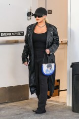 Beverly Hills, CA  - *EXCLUSIVE*  - Singer Christina Aguilera looks flawless in a trendy leather coat and flared black pants while shopping at Yves Saint Laurent on Rodeo drive. Christina accessorized her look with a blue anime graphic handbag.

Pictured: Christina Aguilera

BACKGRID USA 10 NOVEMBER 2022 

USA: +1 310 798 9111 / usasales@backgrid.com

UK: +44 208 344 2007 / uksales@backgrid.com

*UK Clients - Pictures Containing Children
Please Pixelate Face Prior To Publication*