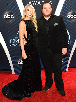 Nicole Hocking, Luke Combs. Nicole Hocking, left, and Luke Combs arrive at the 52nd annual CMA Awards at Bridgestone Arena, in Nashville, Tenn52nd Annual CMA Awards - Arrivals, Nashville, USA - 14 Nov 2018