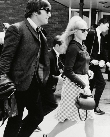 Beatle John Lennon and his wife, Cynthia, pictured at London Airport, when the group arrived from their three-week tour of Australia and New Zealand. At a press conference after his arrival, Lennon denied a rumor that he was leaving the groupCynthia Lennon and John Lennon, London, United Kingdom England